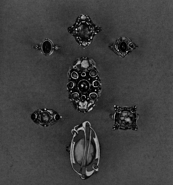 Group of rings showing the use of cabochon, semi-preciious stones, and leaf and flower clusters.